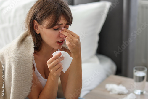 Photos Woman wrapped in blanket suffering from sinusitis at home