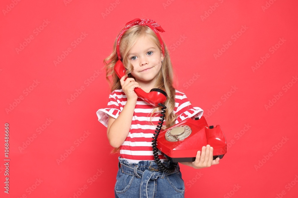 Cute little girl with telephone on red background Cute little girl with telephone on red background