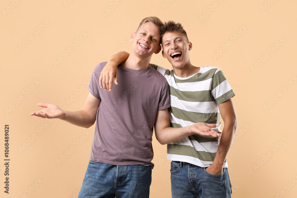 Portrait of happy brothers on beige background Portrait of happy brothers on beige background