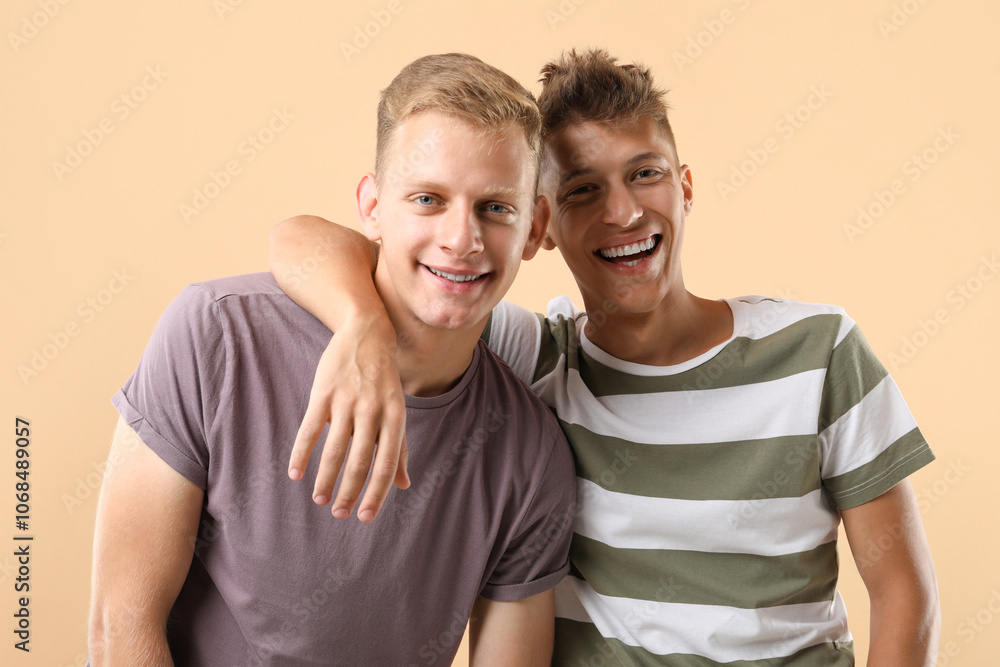 Portrait of happy brothers on beige background Portrait of happy brothers on beige background