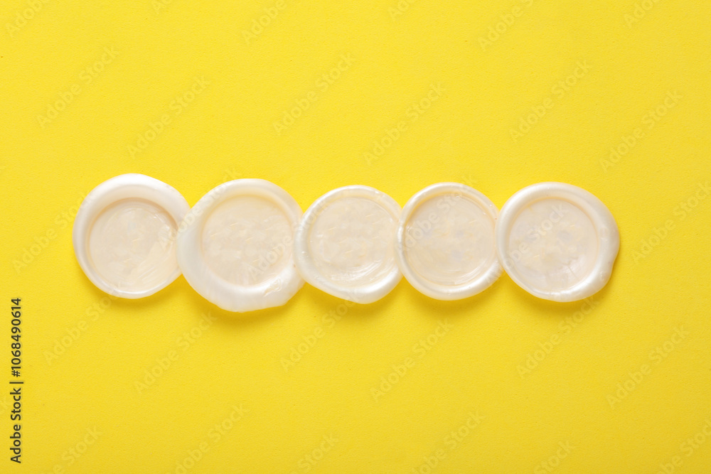 Mockup of white wax seals on yellow background Mockup of white wax seals on yellow background