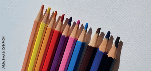 A set of colored pencils isolated on white background. Drawing pencils. A set of colored pencils for school. Bright palette of colors. Pencils in a pencil case.