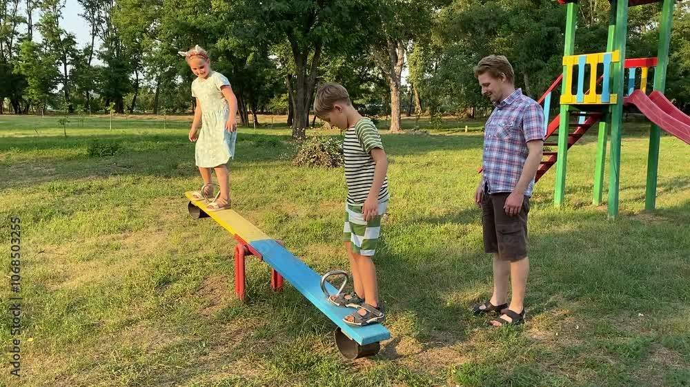 custom made wallpaper toronto digitalA young father enjoys quality time with two elementary aged children at outdoor playground on a warm summer day. The family engages in fun activities, laughter, play, the most of leisure time together