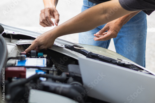 car service center mechanics are checking condition car and engine make sure they are ready use and in perfect condition according center warranty. periodic vehicle inspections for safety in driving. photo