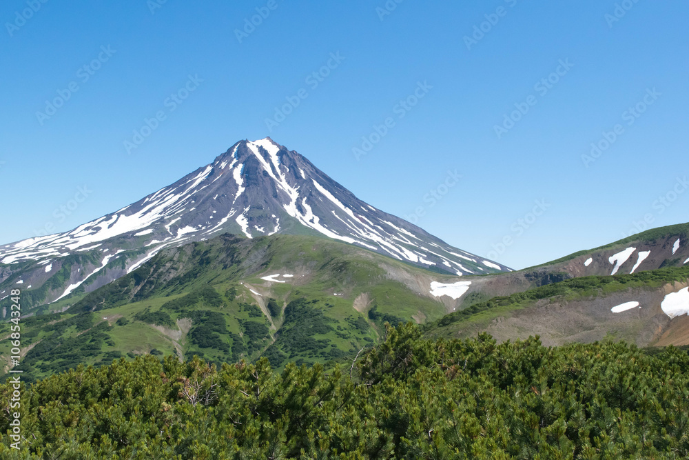 natural landscape in summer daytime view of high volcano Klyuchevskoy in Kamchatka natural landscape in summer daytime view of high volcano Klyuchevskoy in Kamchatka