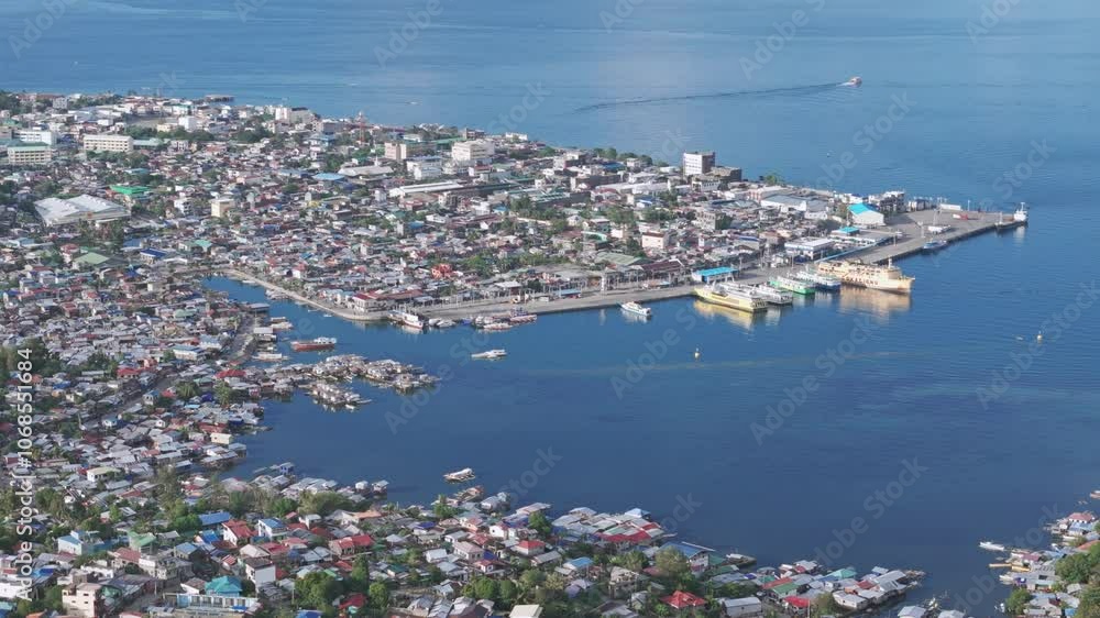 High wide panning aerial view over Surigao City, the most northerly port in Mindanao Philippines. High wide panning aerial view over Surigao City, the most northerly port in Mindanao Philippines.