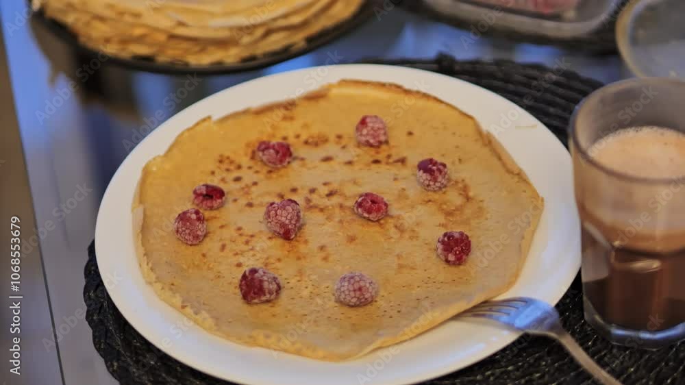 Stacked pancakes with fresh raspberries and coffee on a cozy table, healthy meal Stacked pancakes with fresh raspberries and coffee on a cozy table, healthy meal