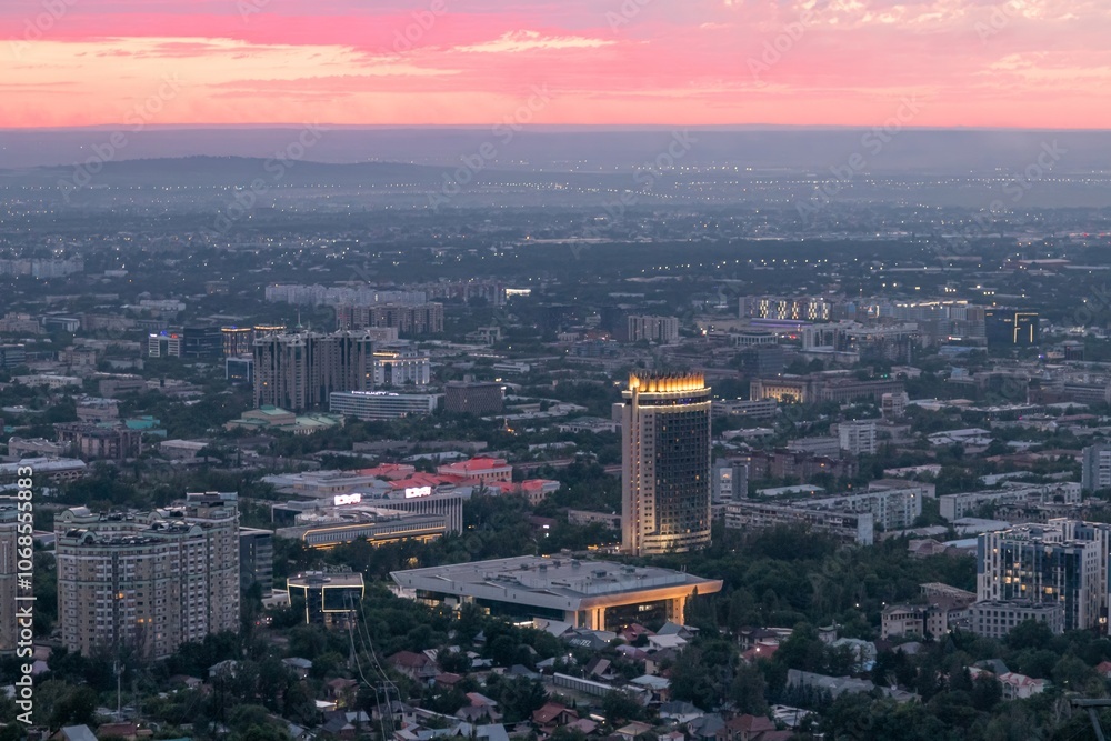Obraz premium Panoramic view of the city of Almaty from the observation deck, sunset, summer time. Sights of Kazakhstan.