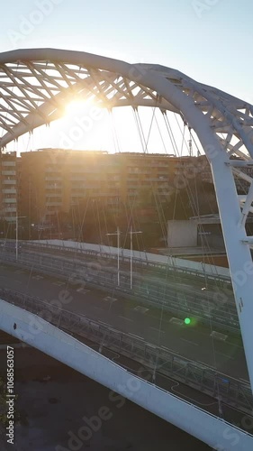 Il moderno ponte Spizzichino del quartiere Ostiense a Roma. Italia.
Vista aerea panoramica all'alba del ponte sulla ferrovia. photo