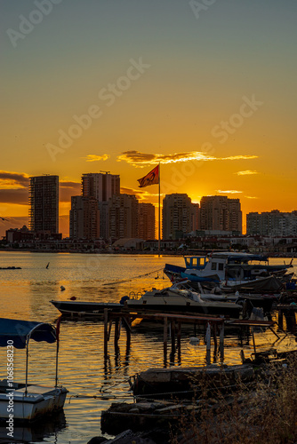 Sunset at Izmir Bostanli Fishermen's Harbor photo