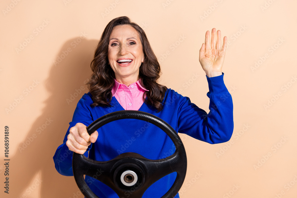 Photo of positive glad charming successful woman wear blue trendy clothes isolated on beige color background Photo of positive glad charming successful woman wear blue trendy clothes isolated on beige color background