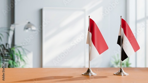 FLAGS OF INDONESIA And YEMEN ON TABLE