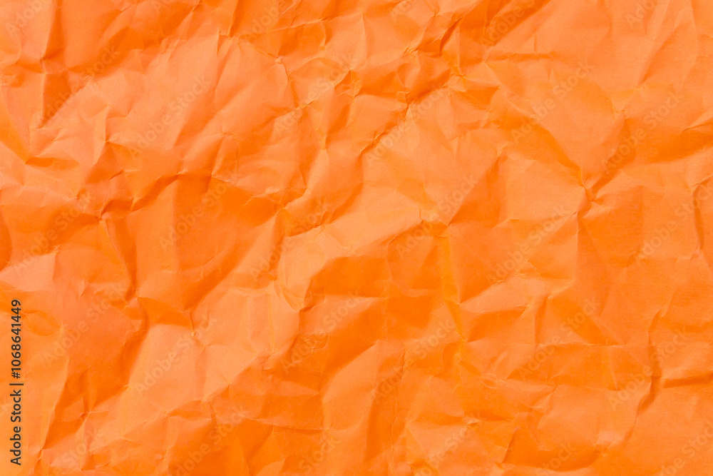 Obraz premium Top view and full frame of wrinkled or crumpled orange paper used as crumpled orange paper background texture.