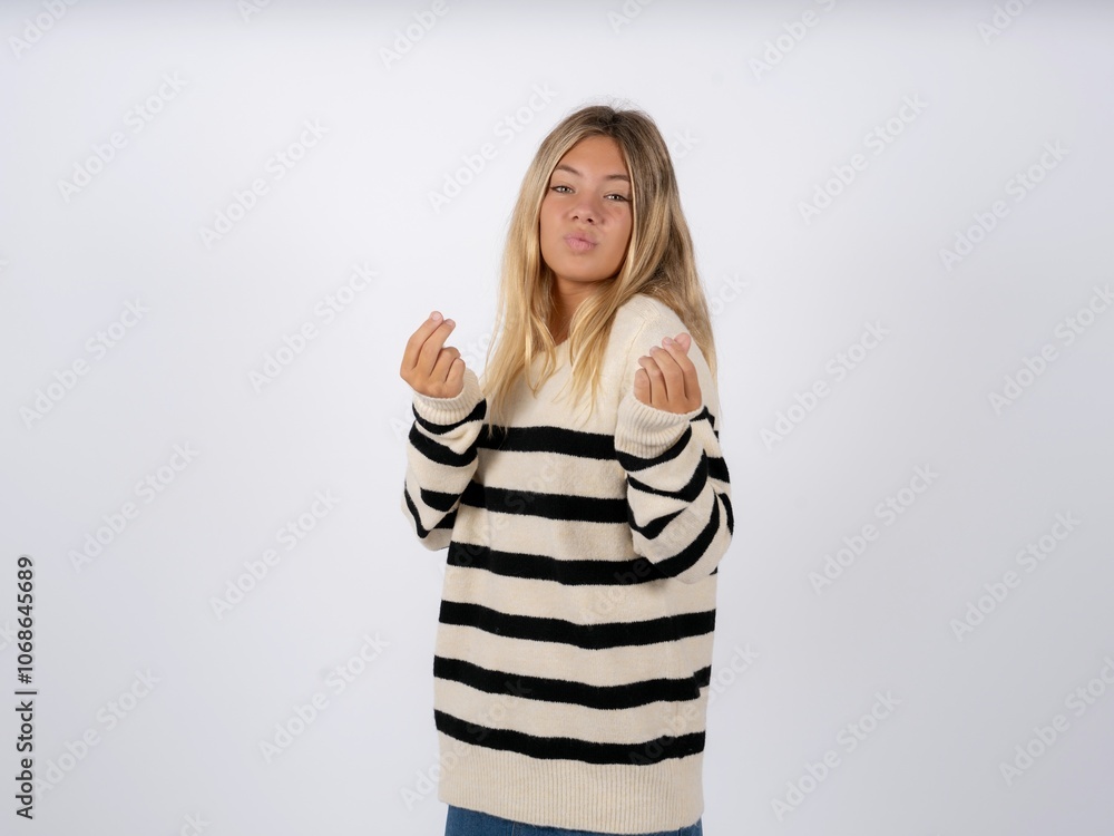 caucasian teen girl wearing striped knitted sweater over white doing ...