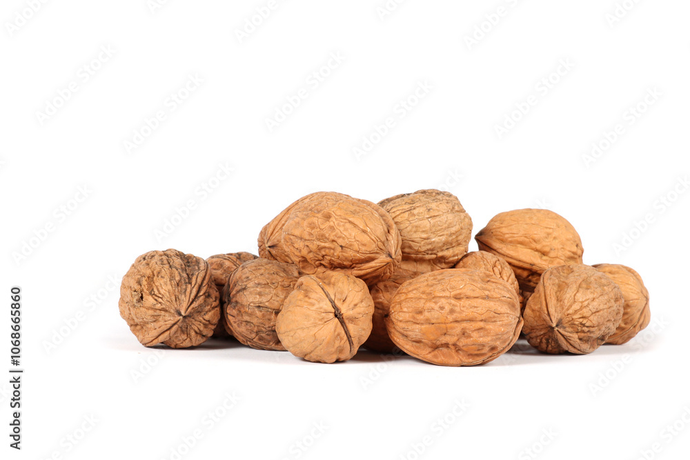 Several whole walnuts on a white background Several whole walnuts on a white background