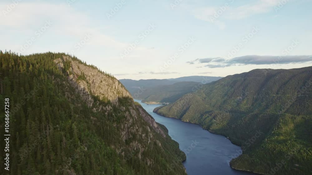 Vast Forest Mountains Surrounding A Fjord During Daytime In Norway Vast Forest Mountains Surrounding A Fjord During Daytime In Norway
