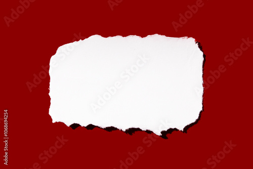 Torn peace of paper on red background