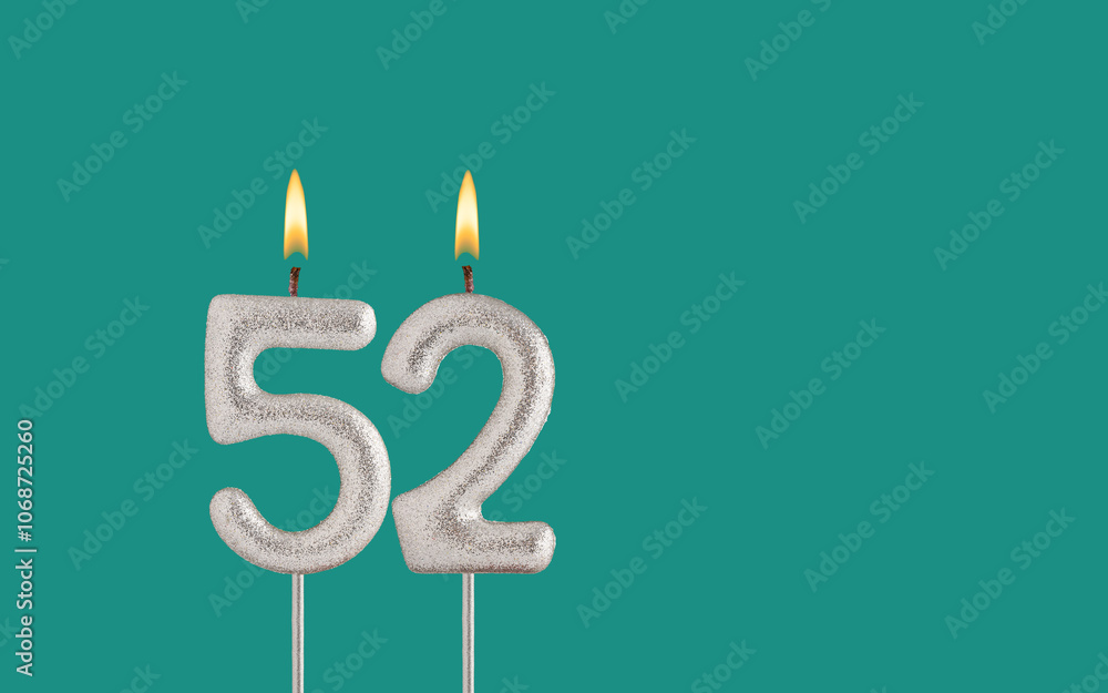 Birthday candle number 52 - Card on a green background. Birthday candle number 52 - Card on a green background.