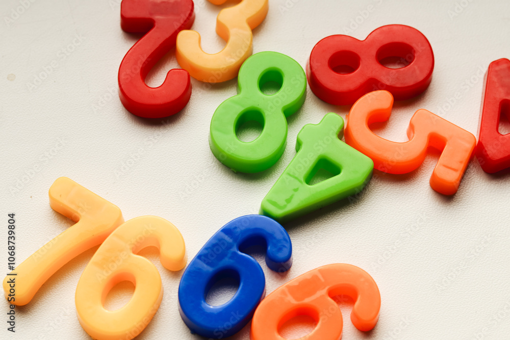 Colorful plastic numbers on a white background.back to school. High quality photo Colorful plastic numbers on a white background.back to school. High quality photo