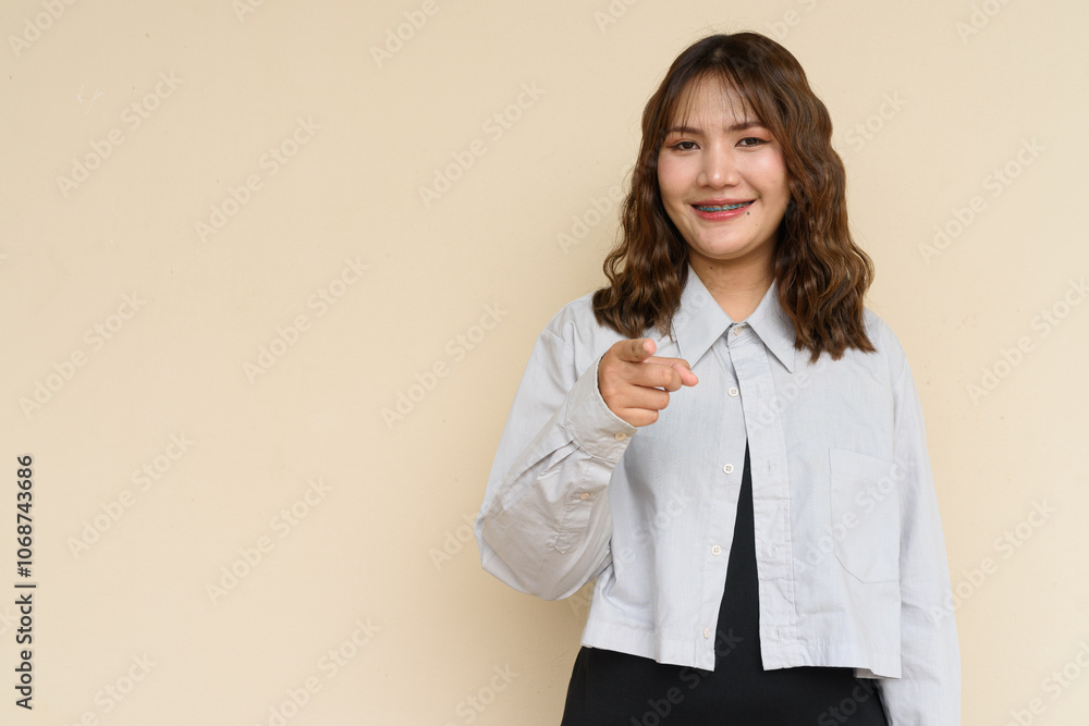 Portrait of Beautiful And Young Cute Asian Woman Against Plain Background Outdoors Portrait of Beautiful And Young Cute Asian Woman Against Plain Background Outdoors