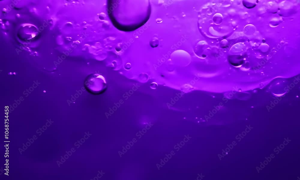 Abstract background of purpel liquid with bubbles forming on its surface, creating a mesmerizing and visually appealing pattern Abstract background of purpel liquid with bubbles forming on its surface, creating a mesmerizing and visually appealing pattern