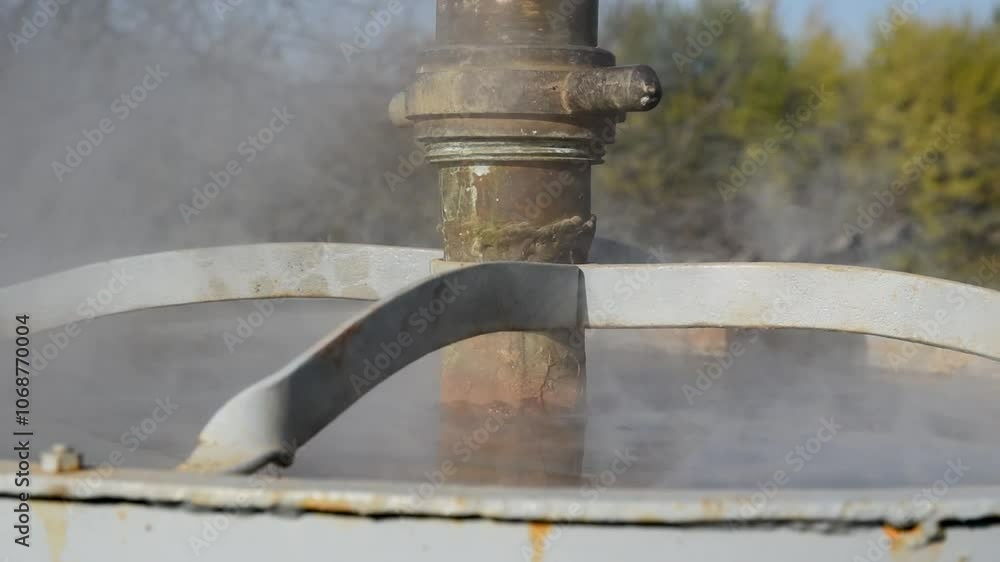 Vapor rise from heated water in brandy cauldron cooler close up Vapor rise from heated water in brandy cauldron cooler close up
