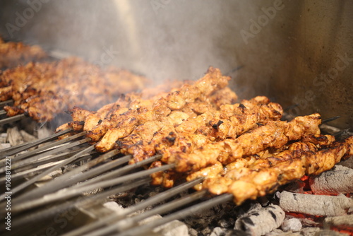 A traditional Turkish kebab being cooked on a charcoal grill. The smoky flavor and tender meat make this a popular dish around the world
