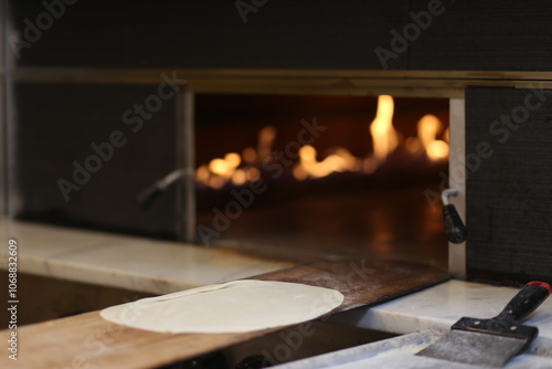 A traditional pizza-making process captured in a single image, showcasing the craftsmanship and passion behind every pizza