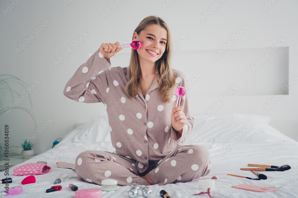 Young woman enjoying morning beauty routine at home with bright smile in cozy pajamas Young woman enjoying morning beauty routine at home with bright smile in cozy pajamas