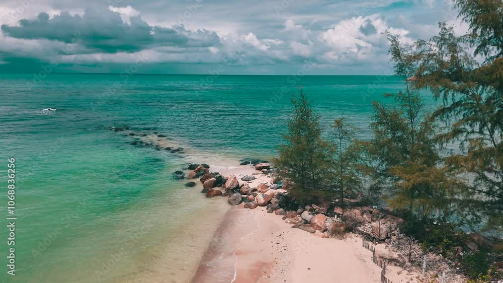Aerial drone view of tropical beach with waves and palm trees. Aerial drone view of tropical beach with waves and palm trees.