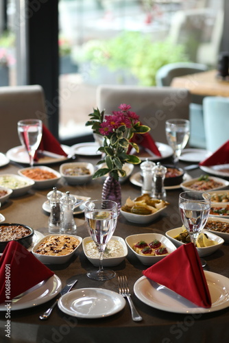 Obraz na płótnie A beautifully decorated table set with a variety of Turkish meze, perfect for a special occasion w salonie