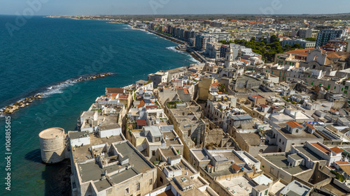 Aerial view of houses, apartments and buildings located in the old town of Molfetta, in the province of Bari, Puglia, Italy.