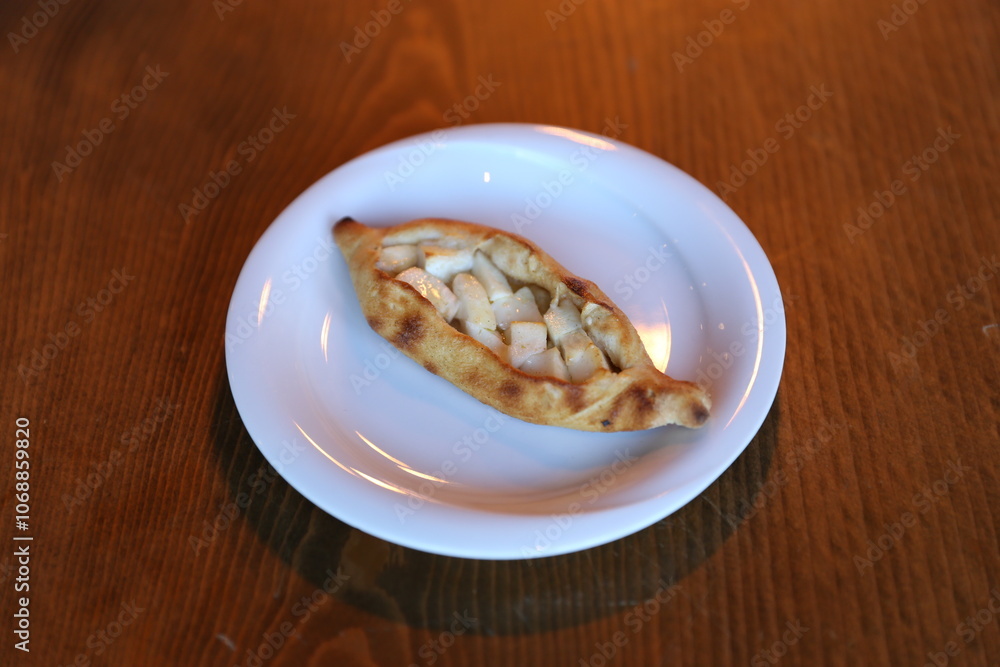 A golden brown and crispy Turkish börek filled with creamy cheese, perfect for a savory snack or breakfast A golden brown and crispy Turkish börek filled with creamy cheese, perfect for a savory snack or breakfast