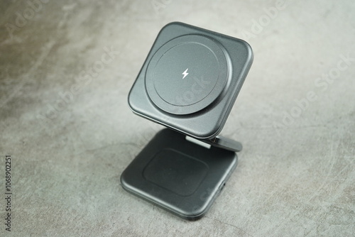 Wireless battery charger isolated on gray background