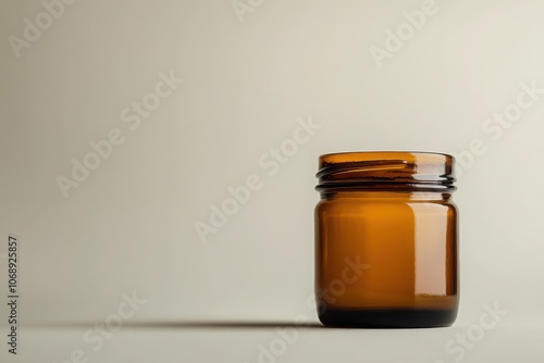 Dark amber glass jar with a label, simple and elegant, minimalistic look, light gradient background