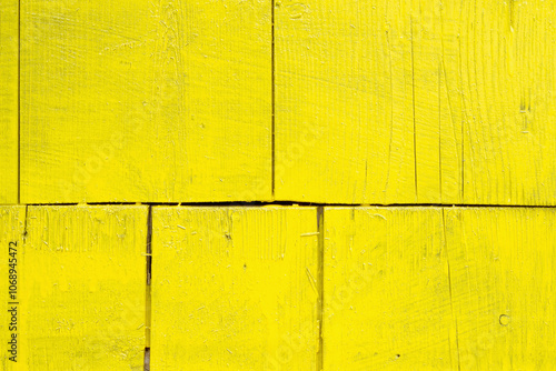 Abstract background, wooden surface painted with yellow paint