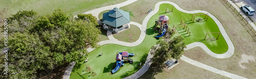 Panorama view residential neighborhood parked car on street near playground artificial turf, pavilion and climbing, sliding structure at community recreational facility, playing structure, Dallas