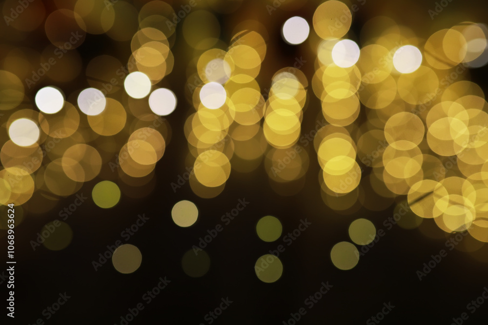 Fototapeta premium Abstract Golden Bokeh Lights Blurred Background - Festive and Elegant Lighting