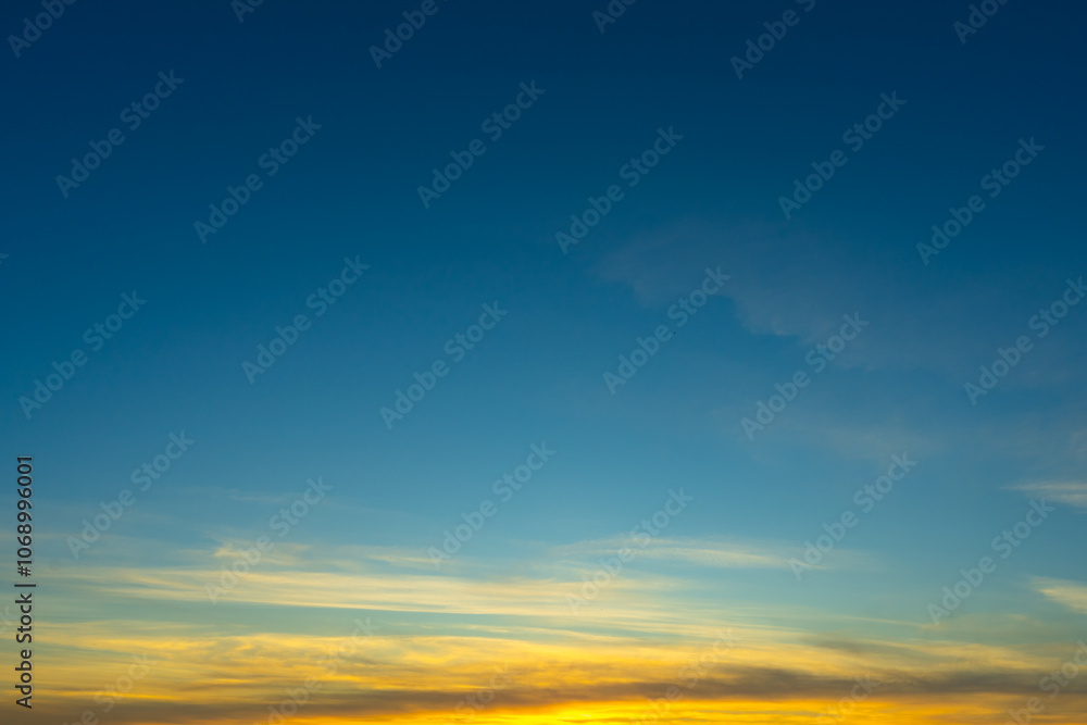 Fototapeta premium Blue Sky with Colorful Cirrus Clouds at Sunset. Abstract Texture Background.