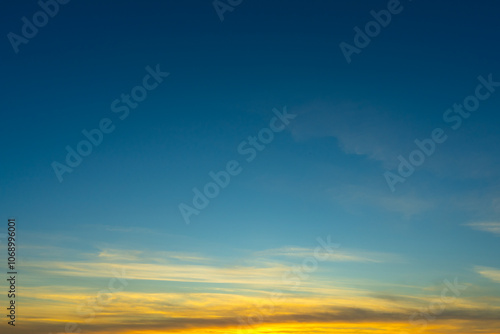 Blue Sky with Colorful Cirrus Clouds at Sunset. Abstract Texture Background.