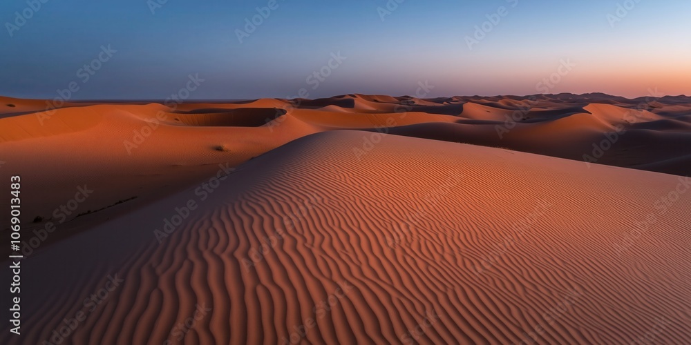 Naklejka premium Sonnenuntergangsfarben über Sanddünen in der Wüste