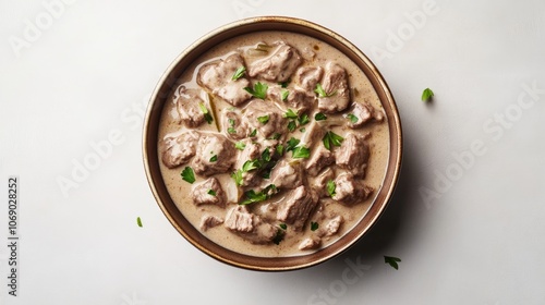 Creamy Beef Stew in a Brown Bowl. photo