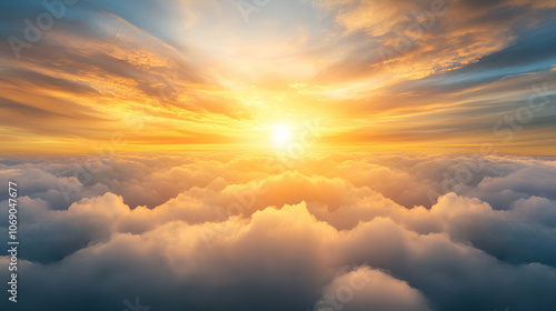 Beautiful sunset and cloudy sky from an aerial view. Airplane view above clouds photo