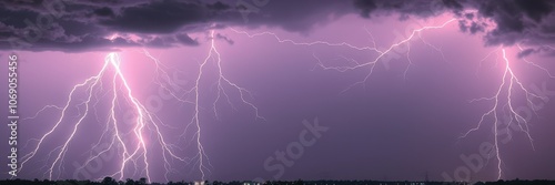 Lightning strikes illuminate the purple sky during a stormy night