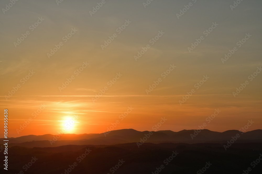The sunset and its rays dazzle the green forests and meadows The sunset and its rays dazzle the green forests and meadows