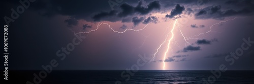 A bright lightning strike illuminates the dark sky over the ocean