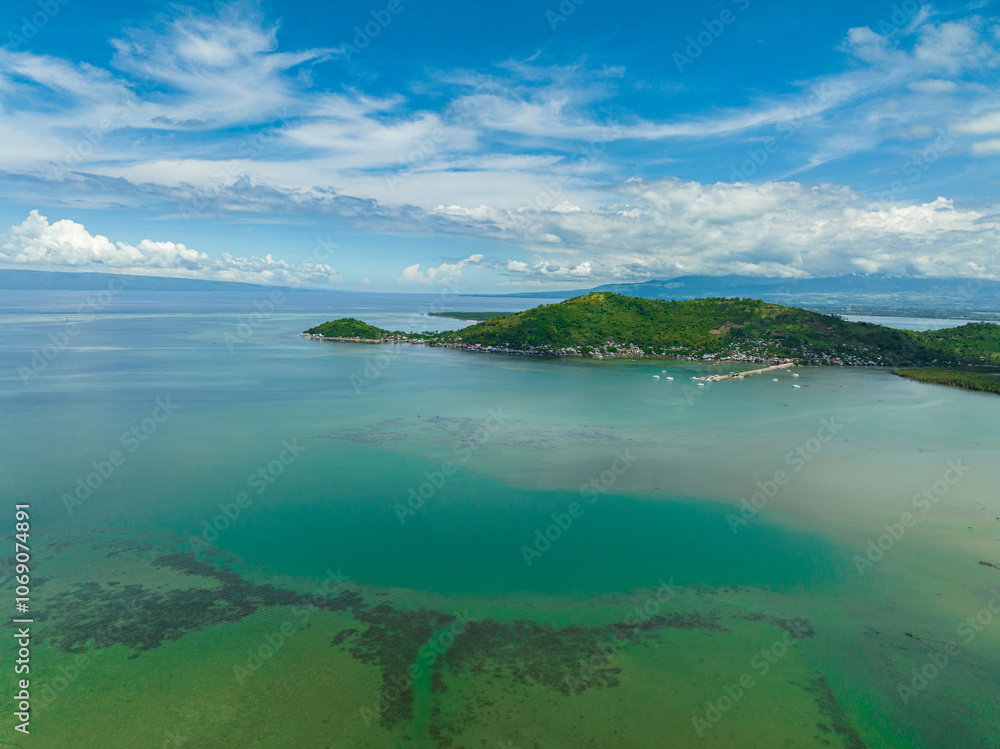 Top view of coast of Negros Island with farmland and town. Negros, Philippines. Top view of coast of Negros Island with farmland and town. Negros, Philippines.