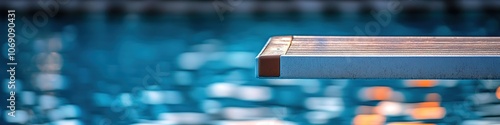 Close-up of springboard over clear swimming pool water