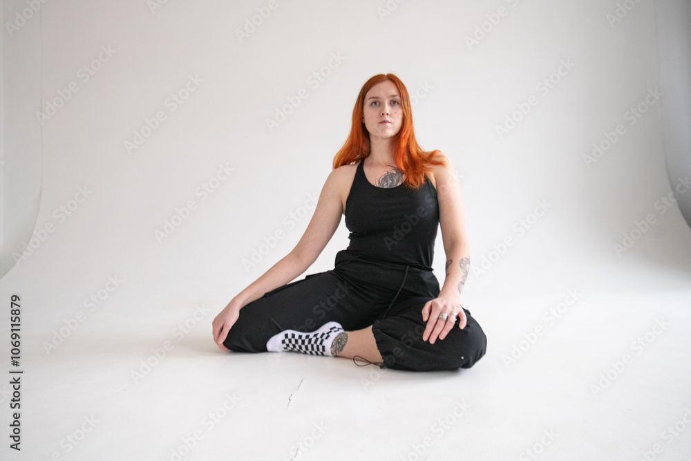 Studio portrait of a young beautiful red-haired girl. Studio portrait of a young beautiful red-haired girl.