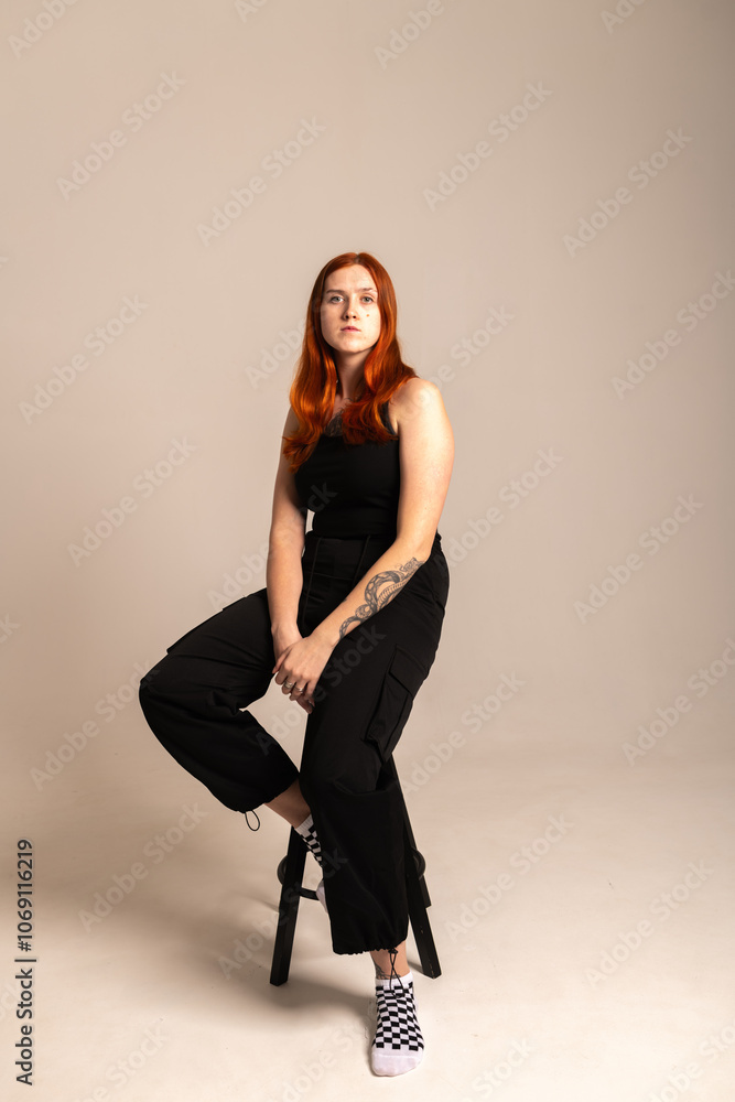 Studio portrait of a young beautiful red-haired girl. Studio portrait of a young beautiful red-haired girl.